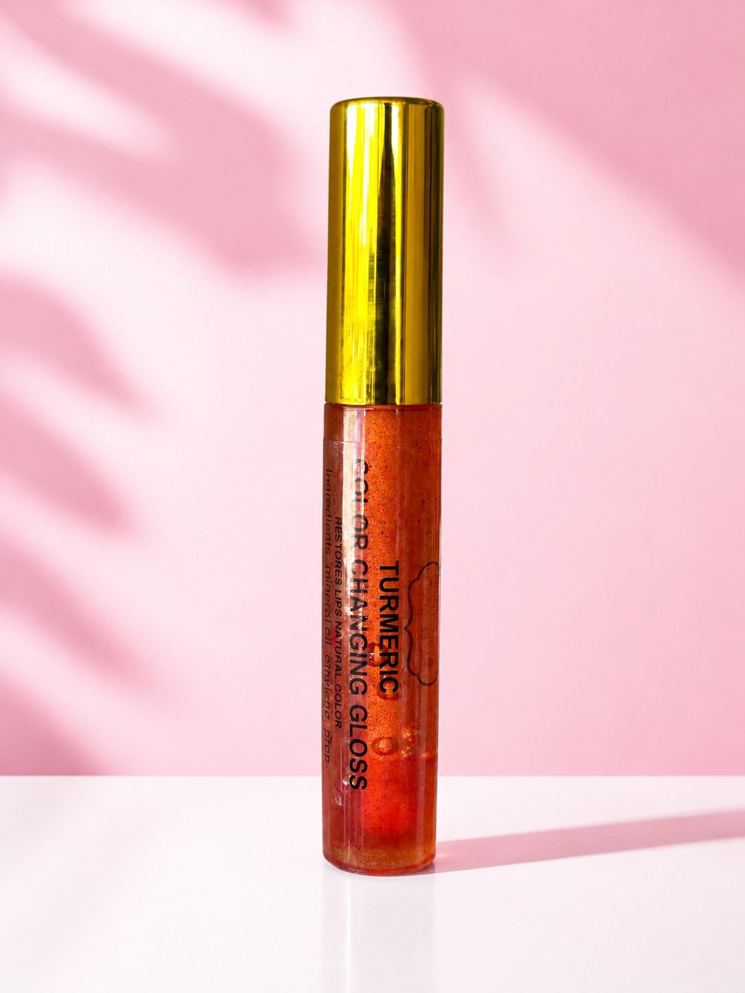     turmeric color changing lip gloss
