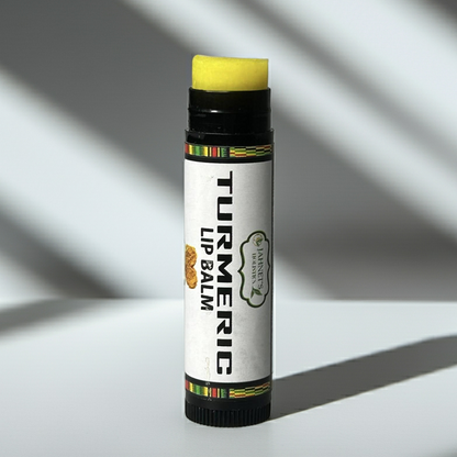 Turmeric lip balm for dark lips made with plant-based ingredients to moisturize, soften, and improve the appearance of lip discoloration.